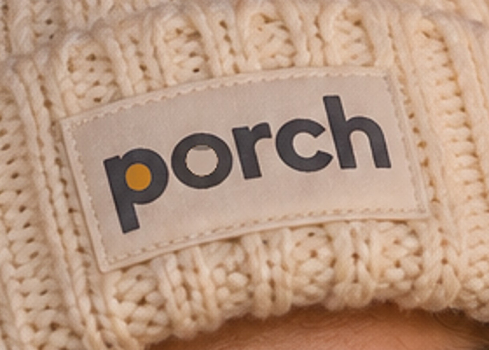 The embroidered p on the beanie cuff