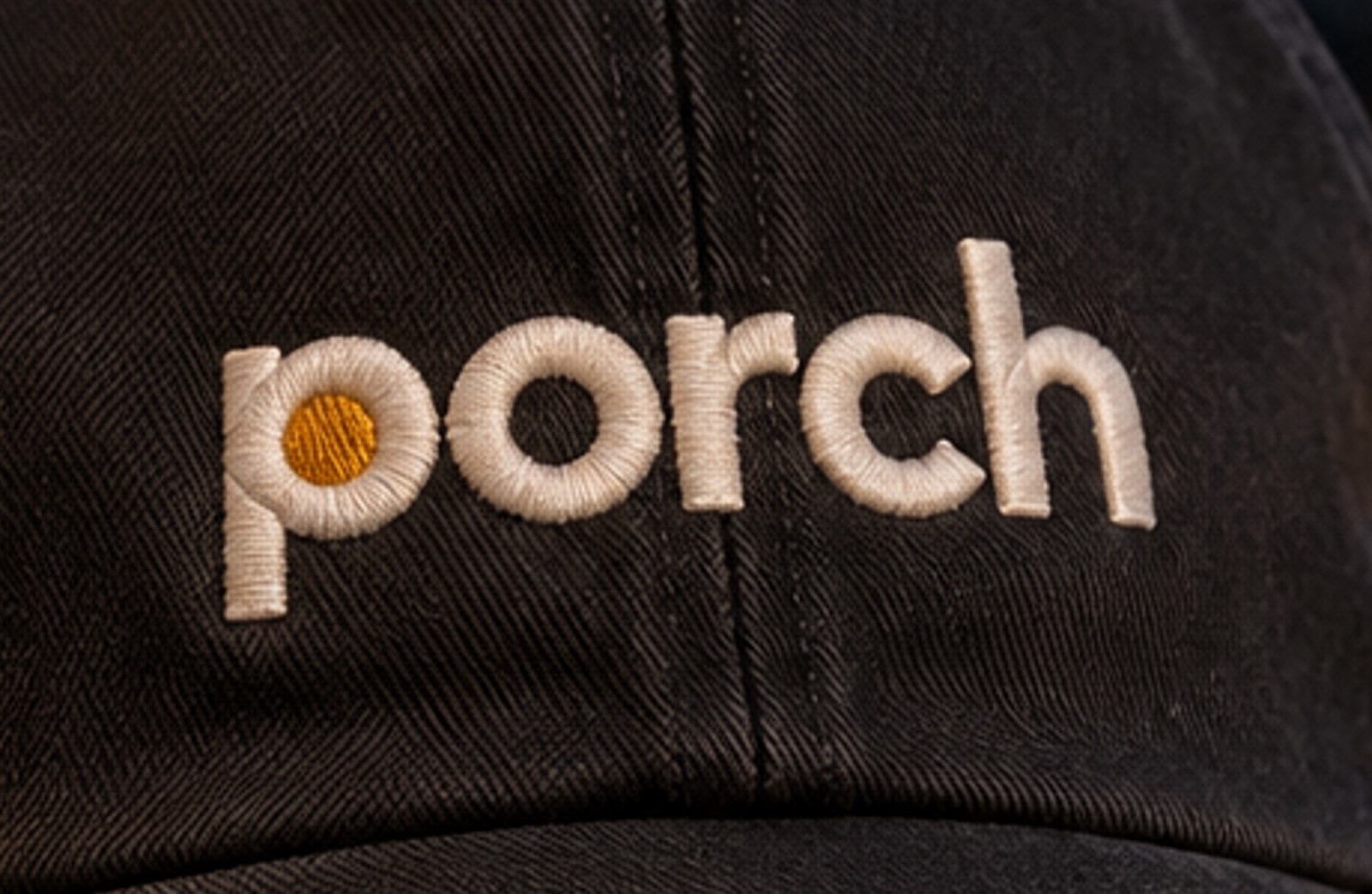 The embroidered p on the cap