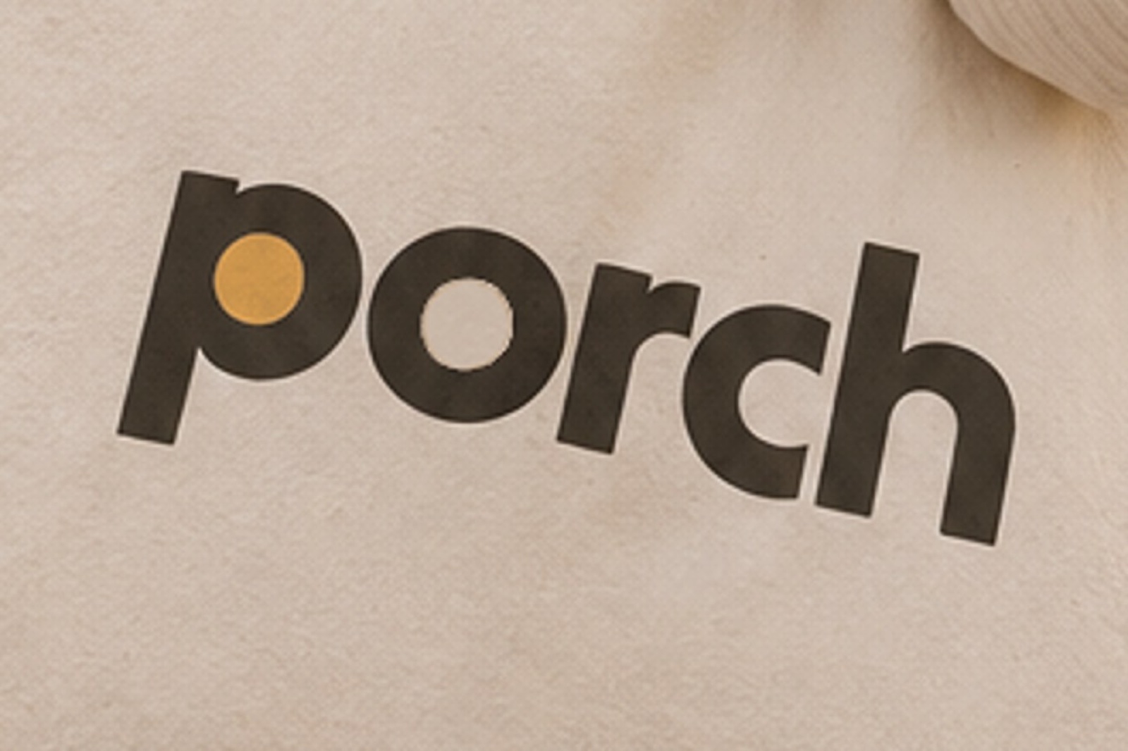 The printed wordmark on the tote